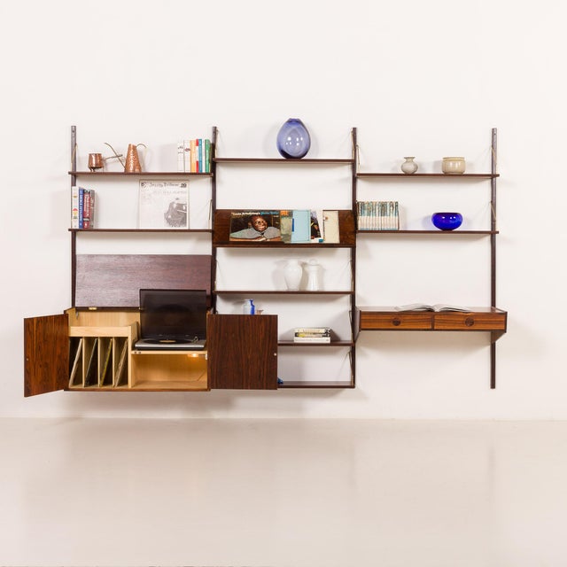 This impressive and rare rosewood wall unit designed by thygesen & johnny sorensen was made by danish renowned...