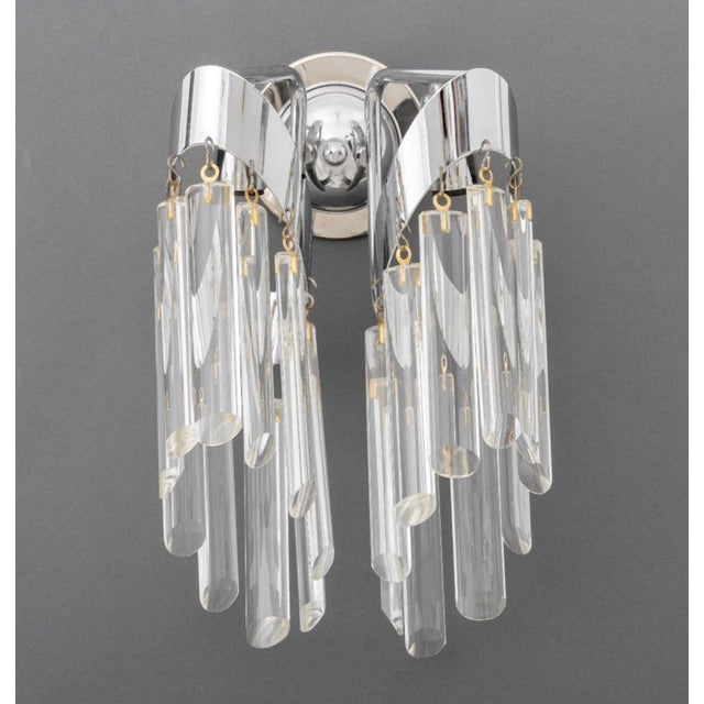 Pair of Modern Two-Light Crystal-Hung Wall Sconces, each with circular chromed back plate and two arms, the lights hung...