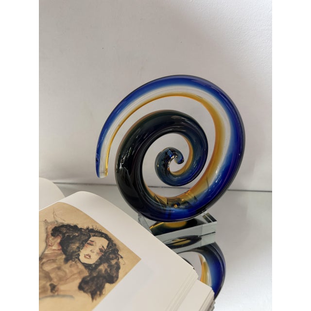 A striking Murano glass sculpture formed as an elegant spiral, created using the traditional sommerso technique. Layers of...