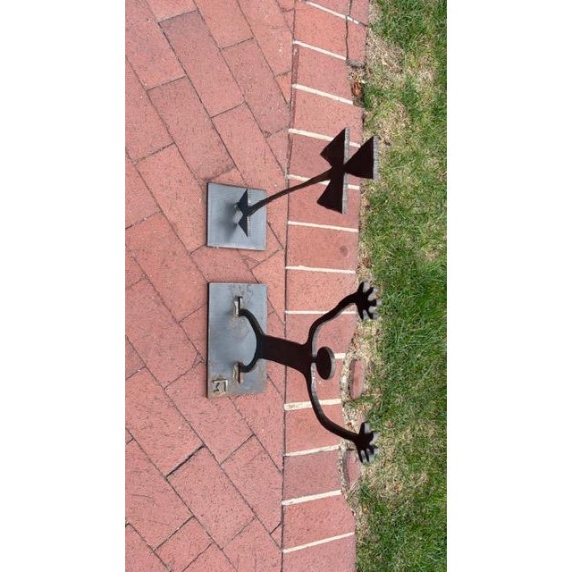 Pair of Brutalist Welded Steel Figural Sculptures, American, Circa 1970s A whimsical pair of handcrafted Brutalist steel...