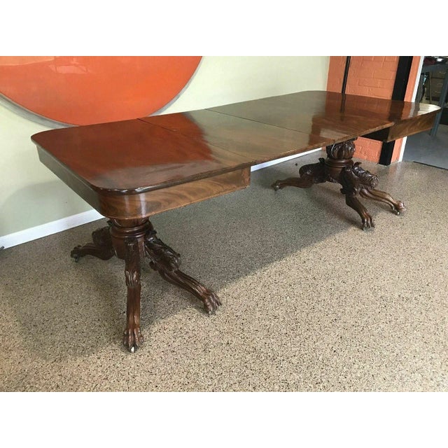 An exceptional pair of Acanthus carved Empire drop leaf stands that join to make a beautiful dining table. A timeless...