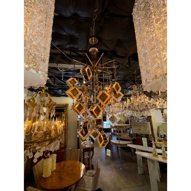 Large Modern Murano glass and brass gold dangle chandelier. Circa 2000. The chandelier has been professionally rewired,...