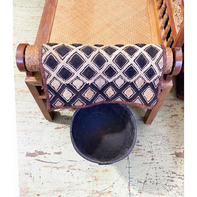 This exquisite Kuba velvet textile, measuring approximately 22" by 23.5", is handwoven from palm fibers using cut-loop...