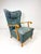1950's high back Swedish lounge chair. Sculpted Birch wood frame. Vintage upholstery.