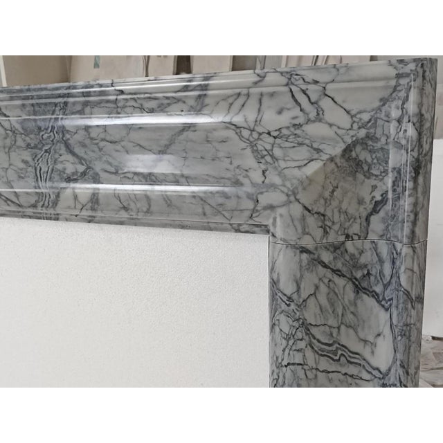 Kent Bolection Mantel in Péle Tigre Marble A refined take on a classic form, the Kent Bolection Mantel is crafted from...