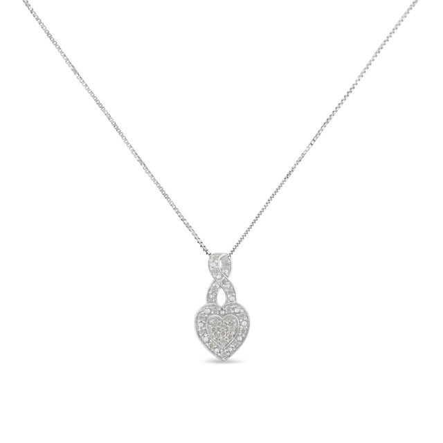 Celebrate someone you love with this stunning diamond heart pendant necklace. This diamond necklace features a knot-style...