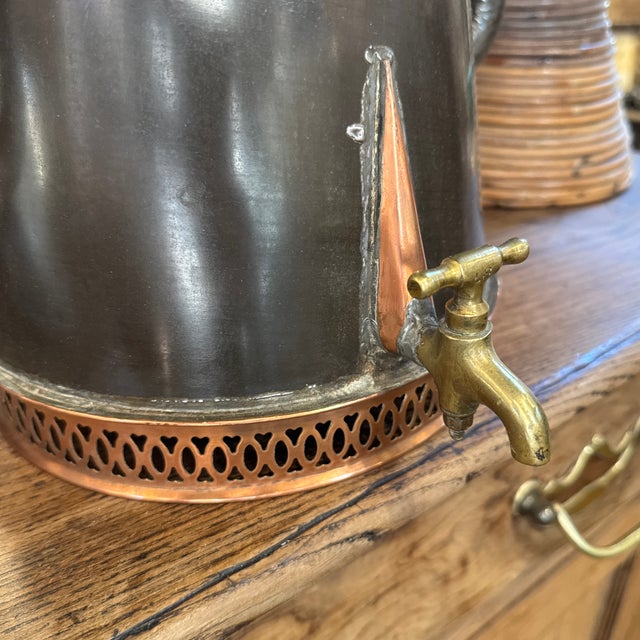 French two-handled peewter coffee pot with brass and copper details. 13ʺW × 9ʺD × 13ʺH 29-069