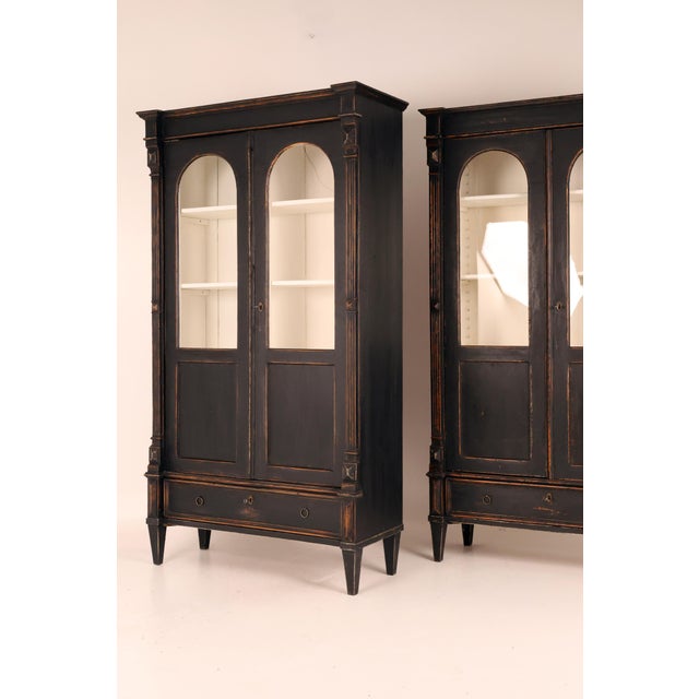 A striking pair of 19th century eclectic display cabinets , architecturally composed and enriched with refined...