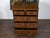 An English George III Period two part oak chest from the early 19th century, with geometric front, five drawers and brass...