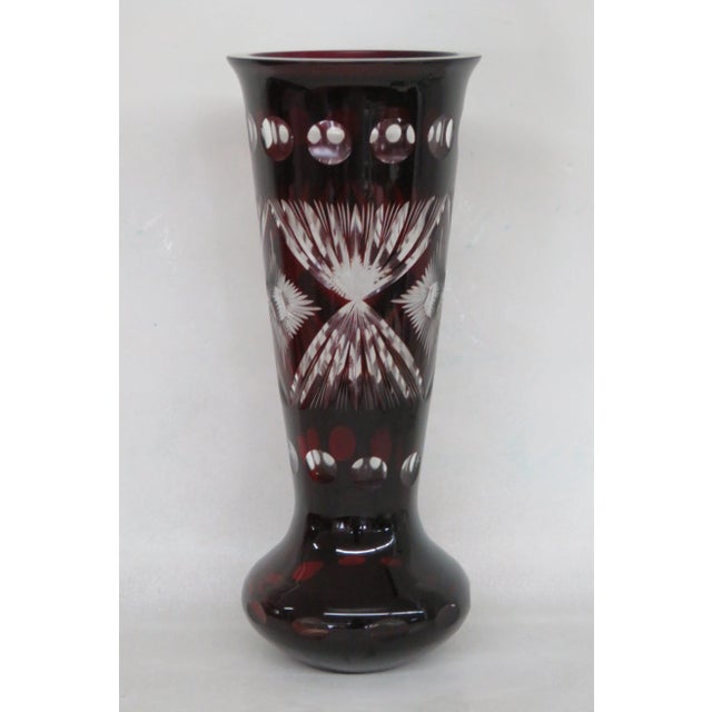 This beautiful Vase is made of glass. This lovely vase has a wonderful bohemian style, it has a tall silhouette with a...