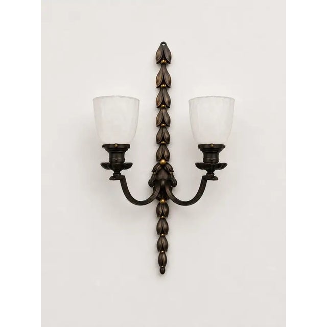 Art Nouveau Two Arms Bronze w Frosted Milk Glass Shades Wall Sconce, a set of 3 A refined set of three Art Nouveau bronze...