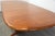 A mid century modern teak oval dining table with two 18.875” leaves which fully extend the table to 101.25”. Made in...