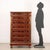 Mahogany tallboy, France first half of the 20th century. Recessed marble top, seven drawer front, grooved uprights,...