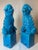 A striking pair of Chinese ceramic guardian lions, commonly known as Foo Dogs, finished in a vibrant turquoise-blue glaze....