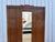 This elegant small French wardrobe from the 1920s is captivating with its harmonious proportions and refined decor,...