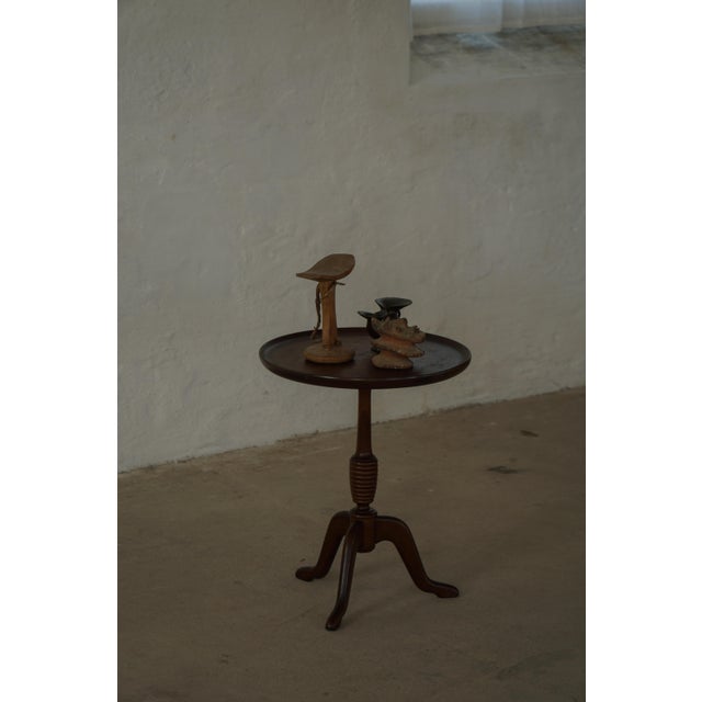 This refined side table is a classic example of Danish Mid-Century Modern design from the 1960s by Anton Kildeberg for...