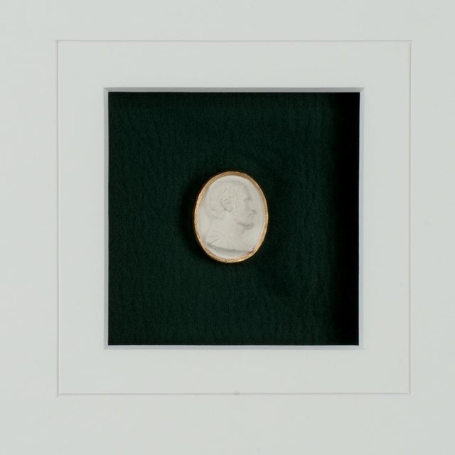 Intaglios on a deep green background in a contemporary gold leaf frame with a 6 ply mat, under glass