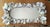 OYSTER WALL MIRROR Multiple layers of natural oyster shells with small white scallop cup shells scattered throughout. The...