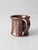 A vintage handmade studio pottery mug finished in a rich chocolate brown glaze with a soft metallic sheen. Its gently...