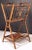 A fine English bamboo Canterbury music stand or magazine rack featuring a bamboo stand with a lyre design in bamboo, with...