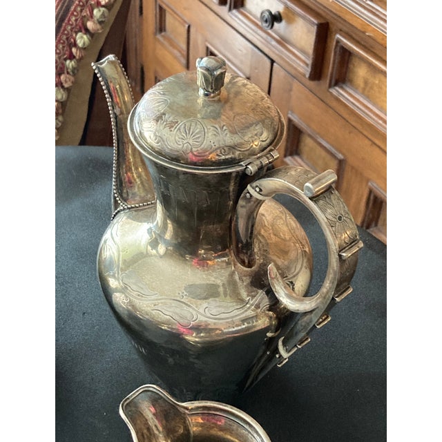 AN AMERICAN STERLING SILVER FIVE-PIECE TEA AND COFFEE SERVICE MARK OF TIFFANY & CO., NEW YORK. CIRCA 1865 Comprising a...