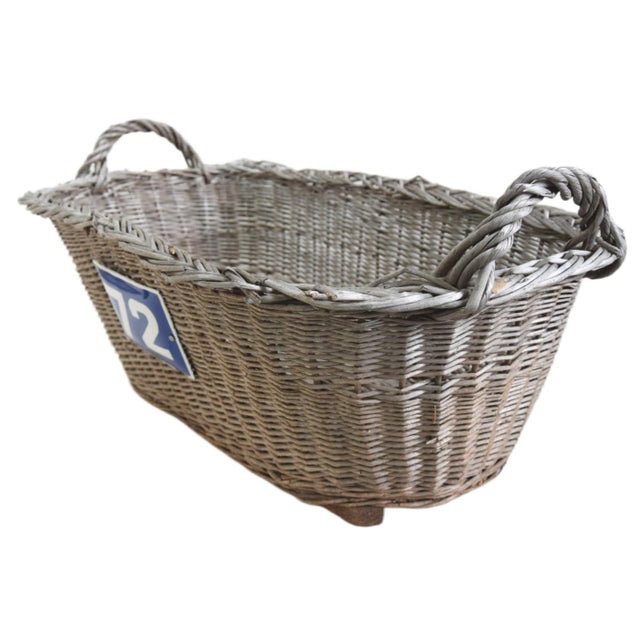Large vintage French handmade woven wicker and willow market basket with braided rim and handles, sturdy woven bottom, and...