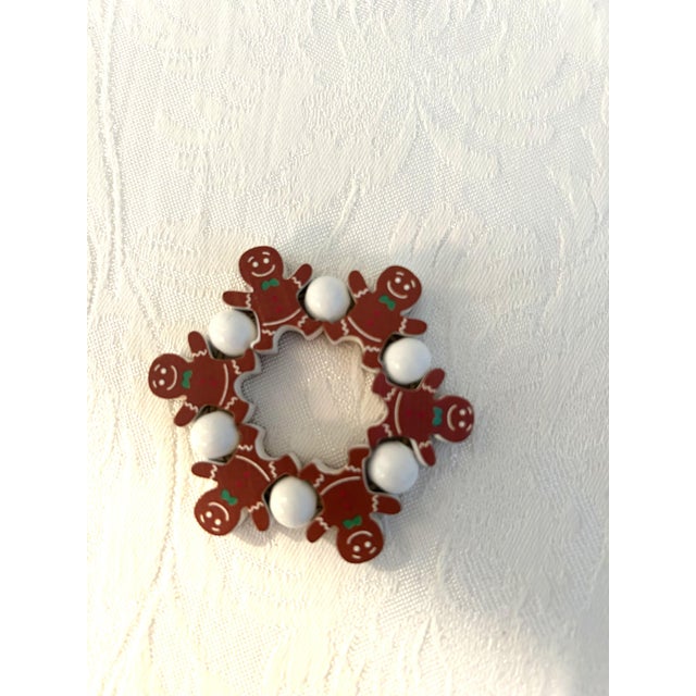 Cute set of twelve wood, elastic banded figural Gingerbread men napkin rings. Excellent condition.