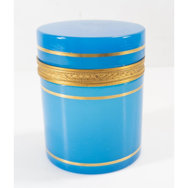 We are selling this stunning vibrant electric blue opaline glass box. This well made box has gilt bronze mounts and gilt...