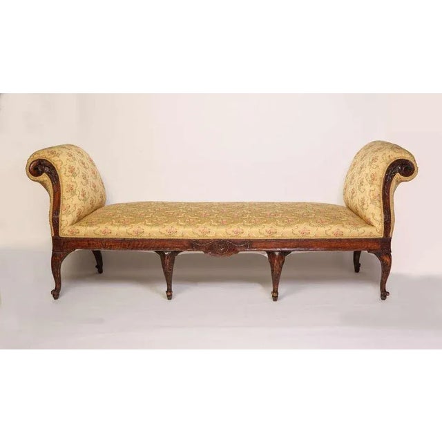 A fine Nord Italian 18'century walnut Settee with scrolled arm-support on 8 cabriole legs, covered with silk fabric of...