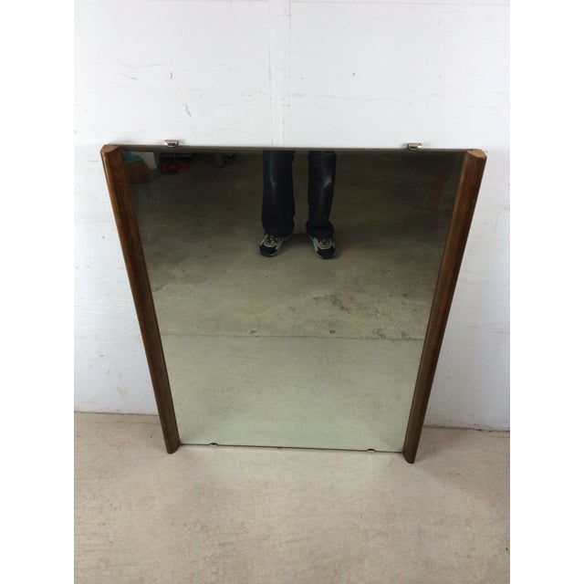 This mid century modern mirror features unique hardwood frame with original walnut finish, beveled glass edge with...