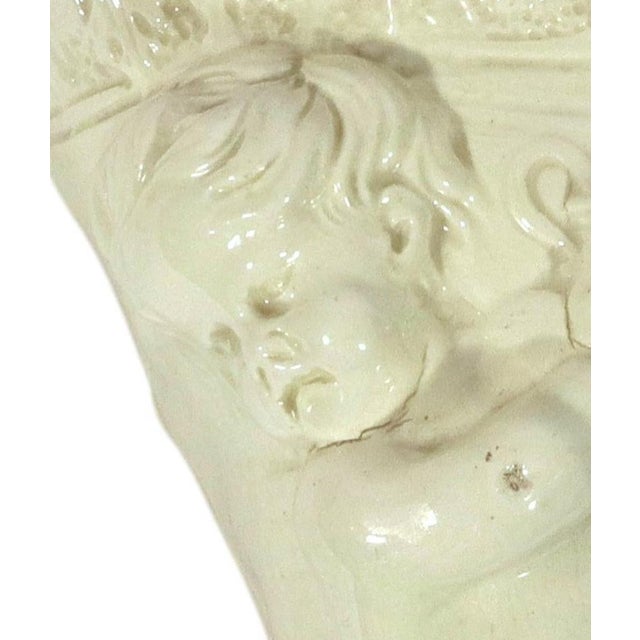 English Creamware Cornucopia Wall Pocket with a Cherub Emblematic of Autumn, Circa 1790 English, Staffordshire or...