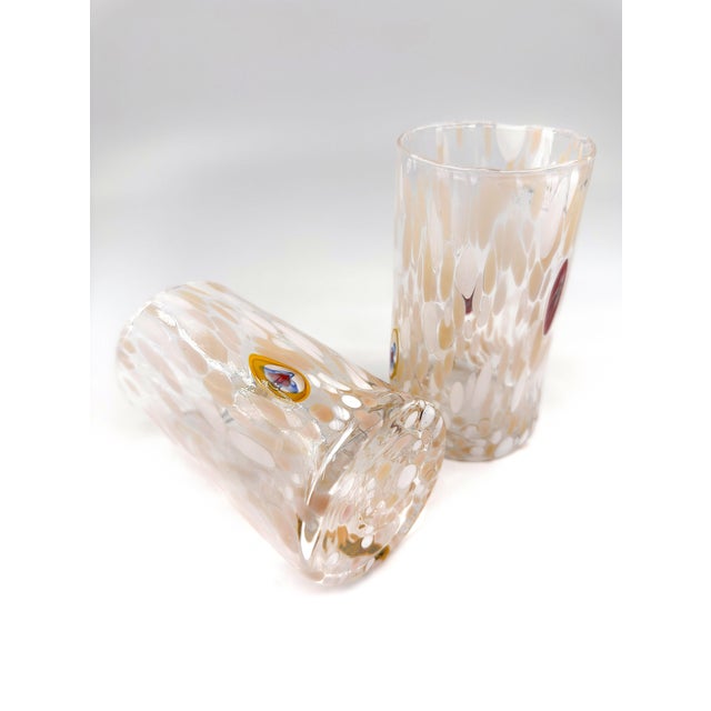 A beautifully set of four hand-blown art glass tumblers attributed to Alessandro Coppola, created by the skilled glass...