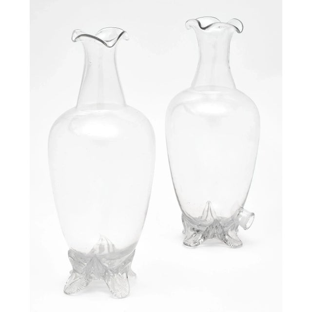 A pair of antique French perfume bottles from Maison Molinard in Grasse next to Nice. One of the bottles has a spigot at...