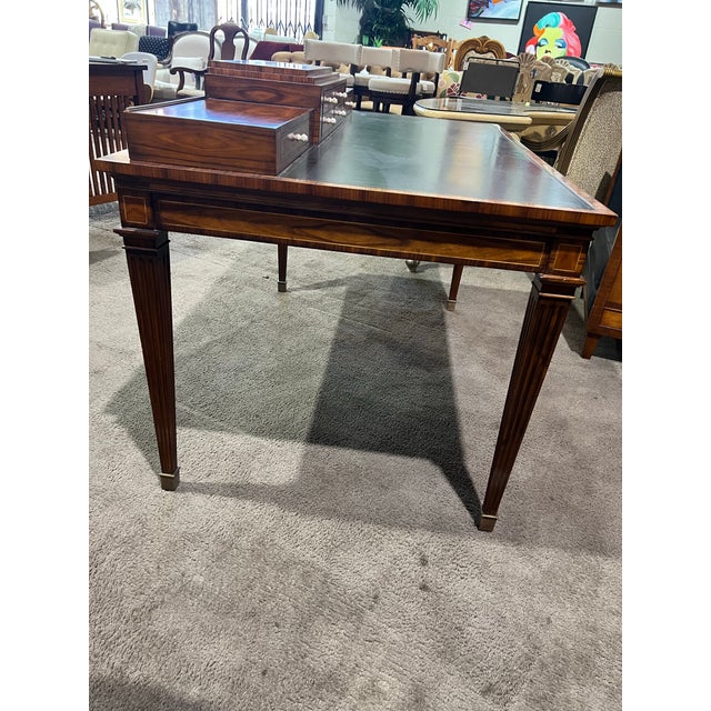 This elegant writing desk by Theodore Alexander exemplifies the brand’s renowned craftsmanship and timeless design....