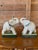 A charming pair of ceramic elephant bookends by Takahashi, made in Japan. Each elephant features an upturned trunk,...