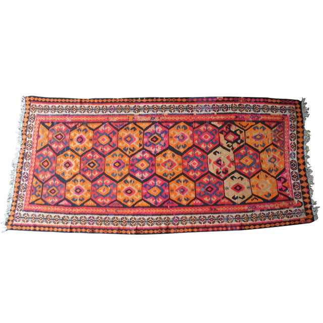 Iranian kilim runner. Vividly colored with a gorgeous geometric pattern. Original tag along the back