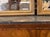 This product is a pair of antique French transitional giltwood mirrors, perfect for those seeking to add a touch of...