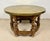 A charming small Spanish center table crafted from solid wood during the mid-20th century. The table features a...