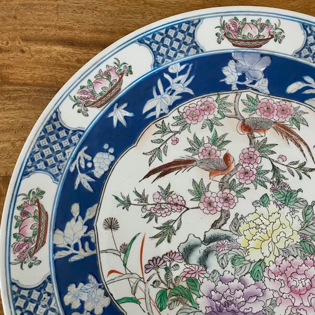 Massive 18" Japanese round porcelain charger hand-painted in a colorful bird and botanical motif. Makes a beautiful tray...