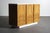 Petite burl wood 2-tone credenza/buffet in the manner of Milo Baughman. The cabinet faces and sides are finished with a...