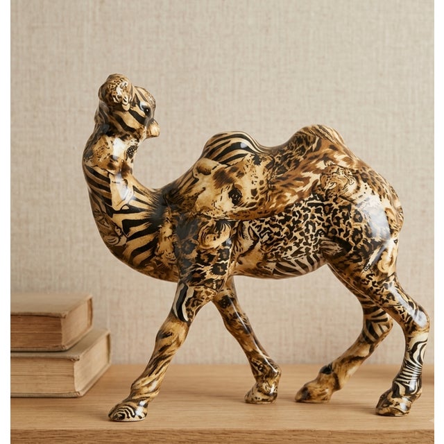 Bring an elegant touch of 1980s postmodernism into your space with this striking ceramic camel figurine from the highly...
