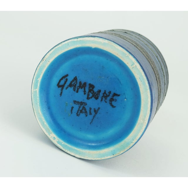Exceptionally beautiful small Italian mid-century ceramic vase by Bruno Gambone. Striped decor in intense blue and...
