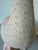 Charming handcrafted ceramic duck sculpture featuring a soft cream finish with subtle blush-pink accents. The piece is...