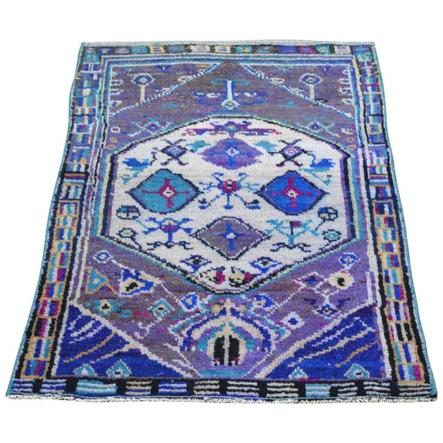 Hand-knotted with care using traditional rug-making techniques, this wool rug blends timeless craftsmanship with a modern...