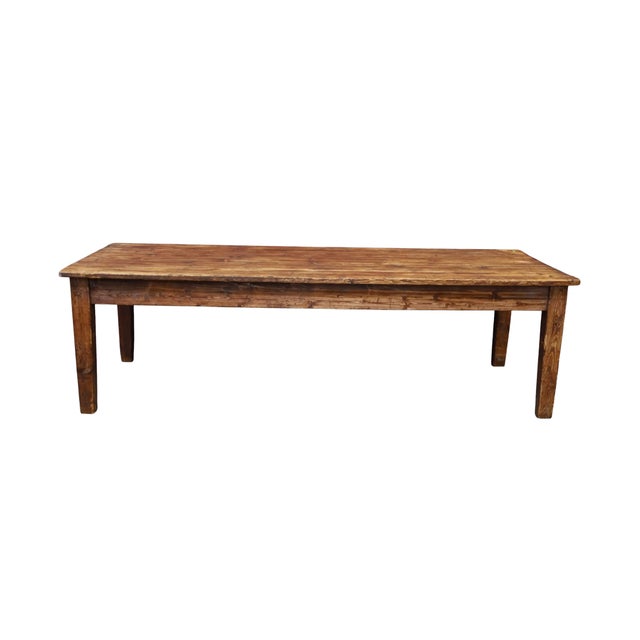 Rare, stunning primitive farm dining set including one long table and two benches. Crafted of pine. Five pine board table...