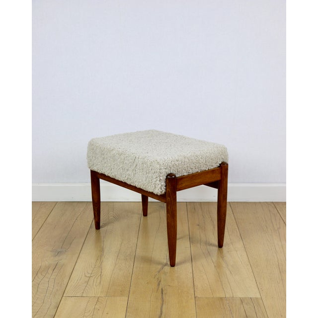 Edmund Homa stool with a cream beige boucle beige seat, featuring long pile lamb texture seat. This stool, designed by...
