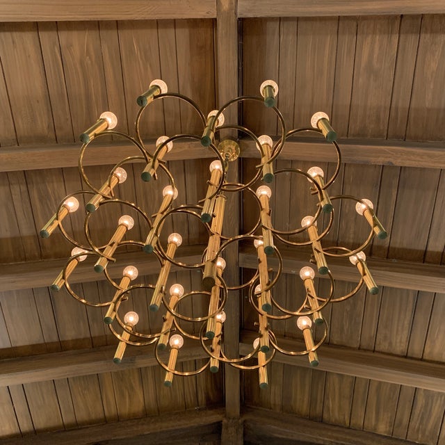 Spectacular Italian mid-century brass 30 light chandelier. In great working condition.