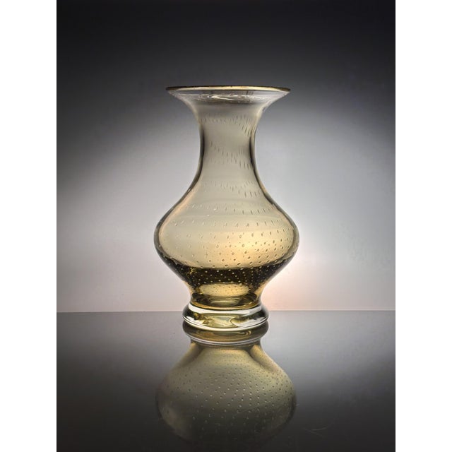 This high quality amber colored glass art vase is attributed the German manufacturer WMF, who produced impressive objects...
