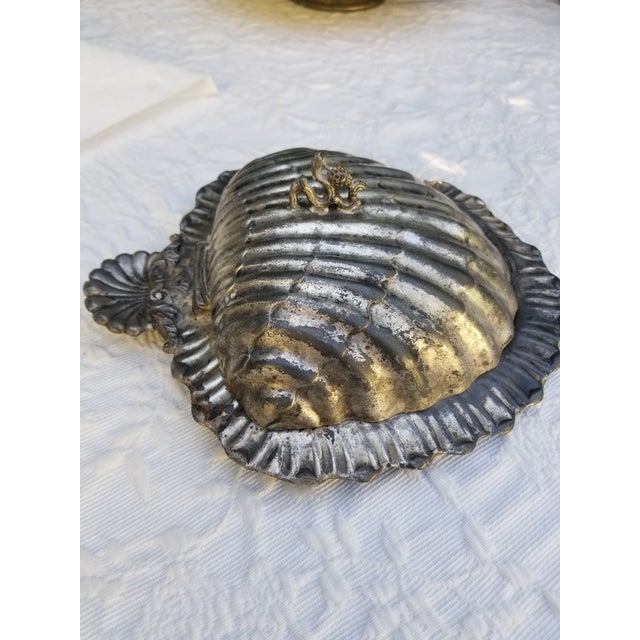 Britannia metal is actually a British name for pewter. This holder is silver, plated over pewter. Pewter was considered...