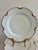 An elegant set of 11 antique Haviland & Co. Limoges porcelain plates, each with a graceful wavy scalloped edge finished in...